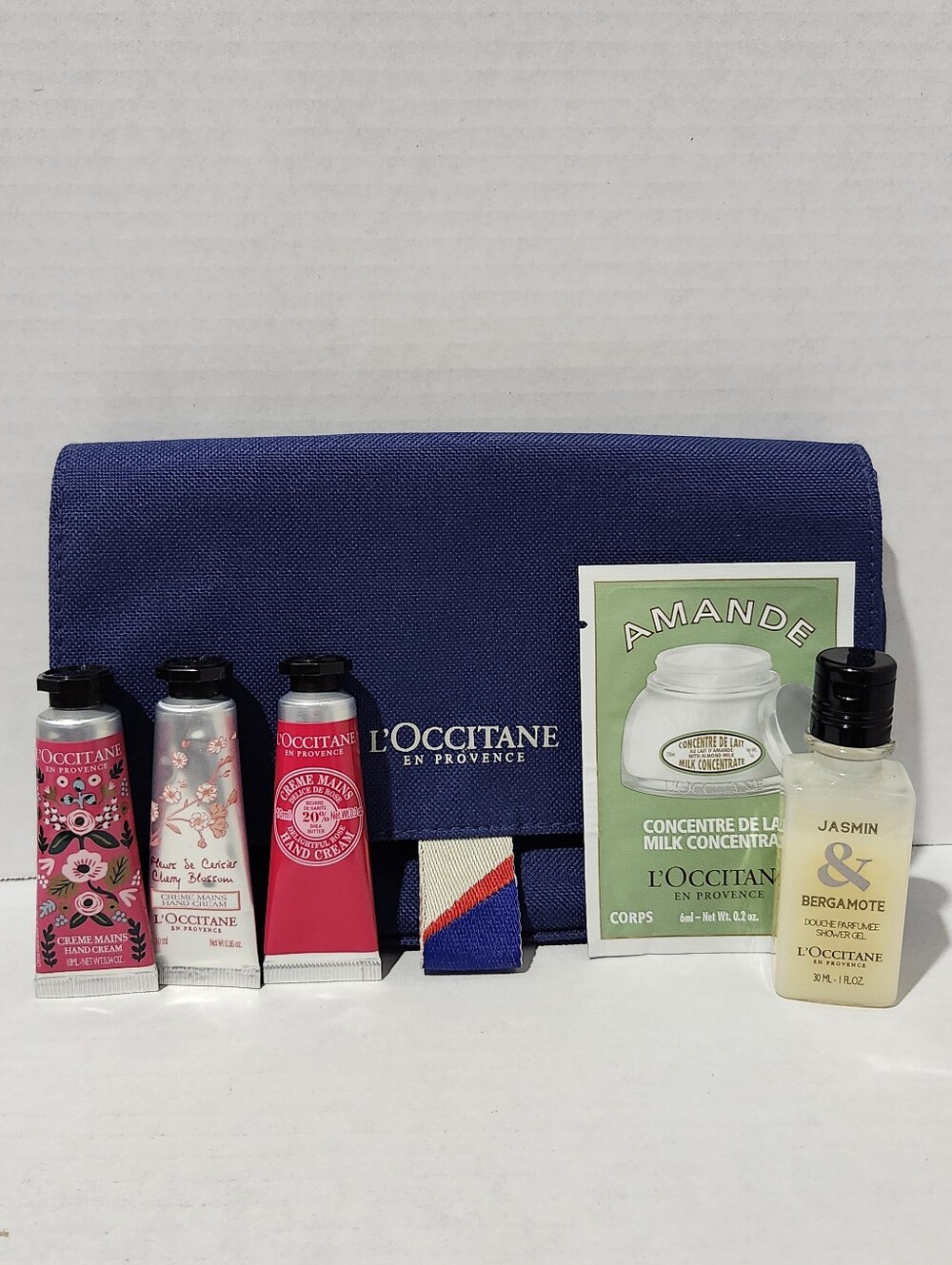 L'OCCITANE Travel Pouch With Hand Lotions, Body Wash & Lotion